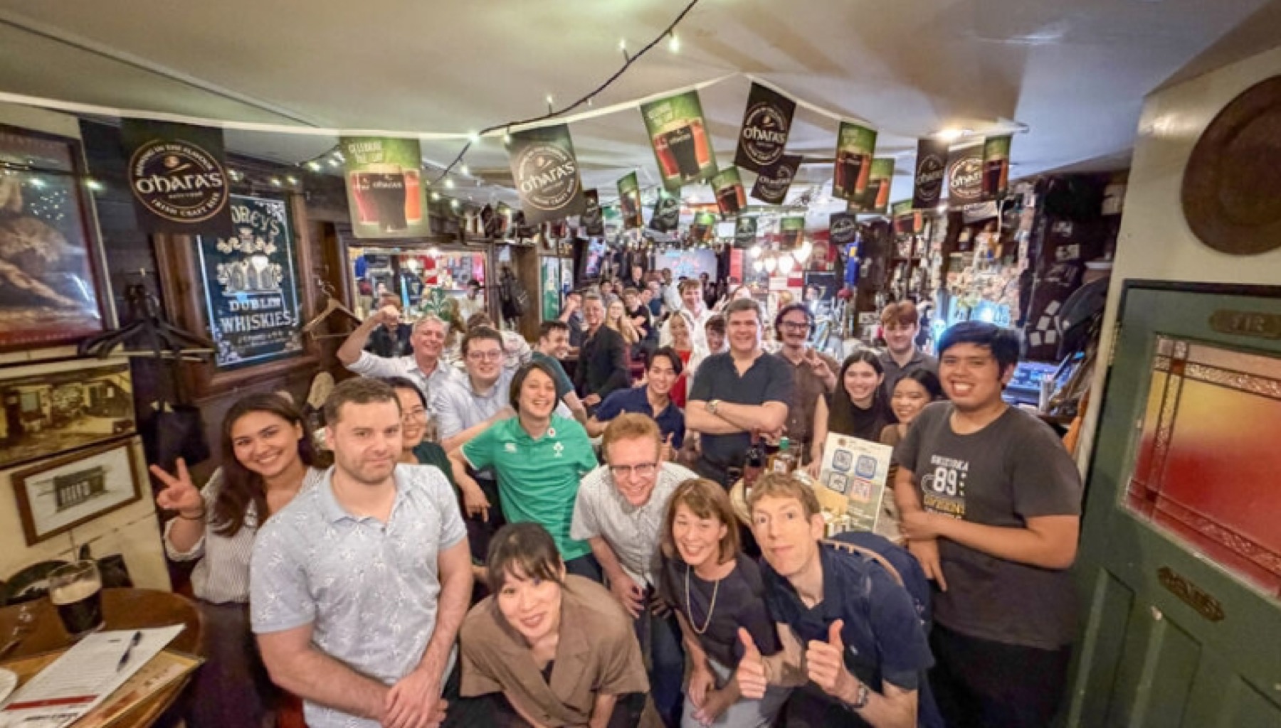 Members gathered together in an Irish pub for a trivia evening